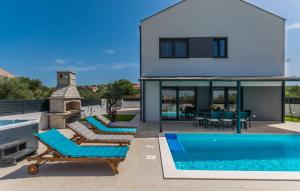 a villa with a swimming pool and a house at Villa MVP in Bibinje