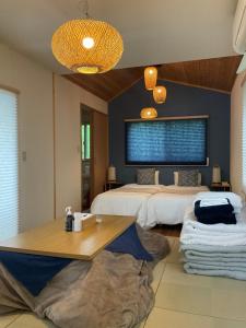 Ein Bett oder Betten in einem Zimmer der Unterkunft Retreat Camp Mahoroba