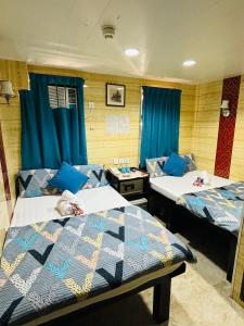 Un pat sau paturi într-o cameră la Philippine Hostel