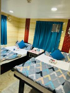 Un pat sau paturi într-o cameră la Philippine Hostel