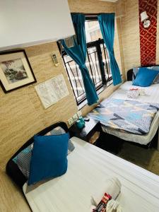 Un pat sau paturi într-o cameră la Philippine Hostel