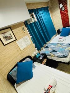 Un pat sau paturi într-o cameră la Philippine Hostel