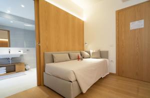 Letto o letti in una camera di Albergo Sorriso
