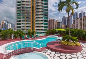 a swimming pool on the roof of a building at Hospedium Princess Hotel Panam&aacute; in Panama City
