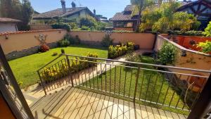 a view of a garden from the balcony of a house at Villa Vittorio in Infernetto