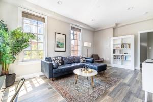 a living room with a couch and a table at Alexandria West 2br w wd nr dining WDC-769 in Alexandria