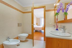 a bathroom with a toilet and a sink at Villa Teide in La Orotava +33 photos