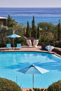 Bazén v ubytování Aquagrand Exclusive Deluxe Resort Lindos - Adults only nebo v jeho okolí