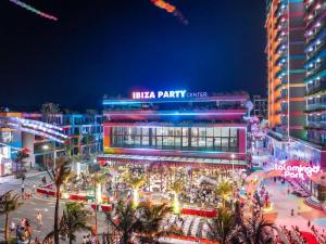 a night view of aislaza party center in a city at Flamingos Hải Tiến in Nam Khê