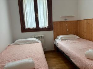 A bed or beds in a room at BPIRINEOS-Las Plazas