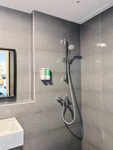 a shower in a bathroom with a shower head at Imperium Residence Kuantan Seaview Level 8 in Kuantan