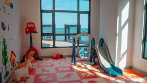 a childs play room with a view of the ocean at Imperium Residence Kuantan Seaview Level 8 in Kuantan +25 photos