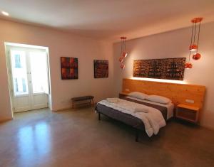 Postel nebo postele na pokoji v ubytování B&B Ibla Art Centro