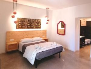 Postel nebo postele na pokoji v ubytování B&B Ibla Art Centro