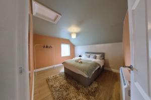 a bedroom with a bed and a window in it at Group Bookings: Up To 30 Guests Across 5 Spacious Flats! Keyless Access Free Wifi & Parking in Birmingham