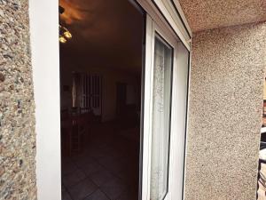 a sliding glass door of a house with a patio at Apartamento LA PLAZA in Bogarra