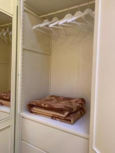 a pile of blankets sitting on a shelf in a closet at Incasa Verona in Verona