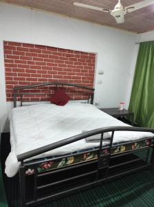 Letto o letti in una camera di Hotel New Heaven Canal