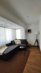 a living room with a couch and a table at La Casa de Lo Xicago in Sant Carles de la Ràpita