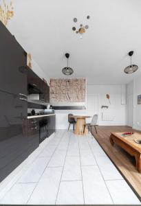 Cuisine ou kitchenette dans l'établissement Résidence Nature - Appartements design en centre ville