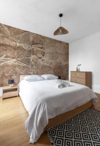 Un ou plusieurs lits dans un hébergement de l'établissement Résidence Nature - Appartements design en centre ville