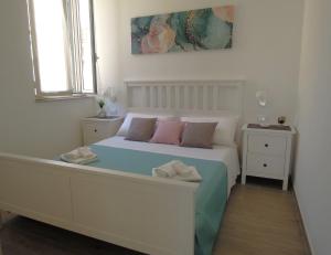 En eller flere senge i et værelse på Casa al mare Circe