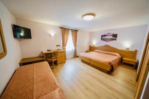 Postel nebo postele na pokoji v ubytování Hotel Siera Hof