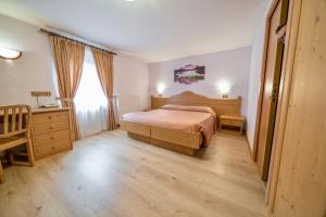 Postel nebo postele na pokoji v ubytování Hotel Siera Hof