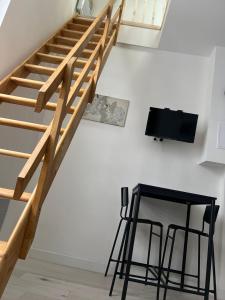 TV a/nebo společenská místnost v ubytování la soie