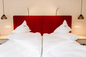 Voodi või voodid majutusasutuse Hotel Gantkofel toas
