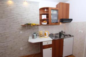Kuchyň nebo kuchyňský kout v ubytování Apartments Frane + 37 fotografií