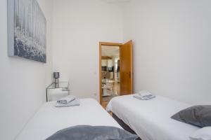 Posteľ alebo postele v izbe v ubytovaní Apartments Lorena