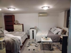 Posteľ alebo postele v izbe v ubytovaní BonBon condominium