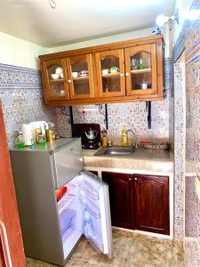 A kitchen or kitchenette at House near the seashore