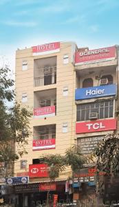 a building with signs on the side of it at Roomshala 160 Hotel Red - Vasant Kunj in New Delhi