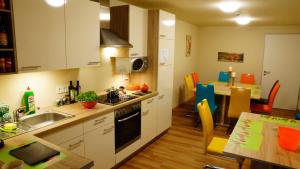 a kitchen with a sink and a counter top at Bavaria City Hostel - Design Hostel in Füssen