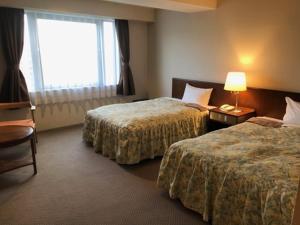 Postel nebo postele na pokoji v ubytování Sky Hotel + 37 fotografií