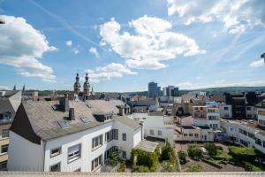 a cityscape of a city with white buildings at Penthouse Panoramablick Whirlpool Parken in Koblenz