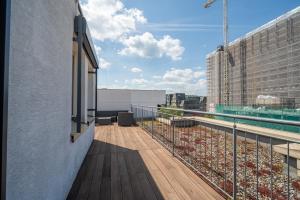 a balcony with a view of a building at Penthouse Panoramablick Whirlpool Parken in Koblenz +8 photos