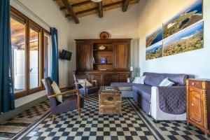 a living room with a couch and a table at Casa sul Mare a Putzu Idu - Grazie di Esistere in Putzu Idu