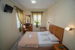 Postel nebo postele na pokoji v ubytování Hotel Argo