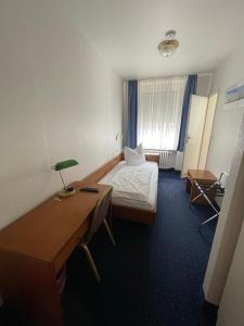 Ένα ή περισσότερα κρεβάτια σε δωμάτιο στο Hotel Horstmann Münster