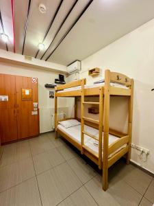 a bunk bed room with two bunk beds in it at Envoy Hostel & Tours in Yerevan