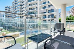 an apartment balcony with a view of a building at Marinada in Benidorm