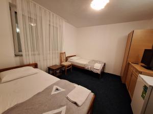 Postel nebo postele na pokoji v ubytování Evropa