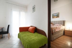 Postel nebo postele na pokoji v ubytování Apartments Milic