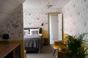 Postel nebo postele na pokoji v ubytování Vanalinna Boutique Hotel