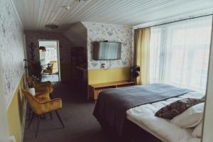 Postel nebo postele na pokoji v ubytování Vanalinna Boutique Hotel