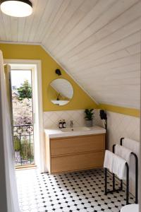 a bathroom with a sink and a mirror at Vanalinna Boutique Hotel in Kuressaare