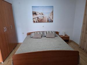 Postel nebo postele na pokoji v ubytování Rumora Ivan Apartment